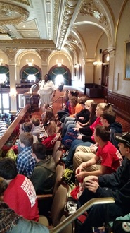 8th graders sitting in the State's House of Representatives room